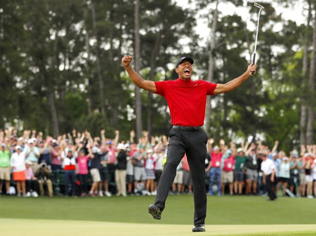 AUGUSTA, GEORGIA - APRIL 14: Tiger Woods of the United States celebrates after sinking his putt on the 18th green to win during the final round of the Masters at Augusta National Golf Club on April 14, 2019 in Augusta, Georgia. (Photo by Kevin C. Cox/Getty Images)