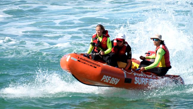 Search crews comb the water at Gunnamatta Beach. Picture: Andrew Henshaw