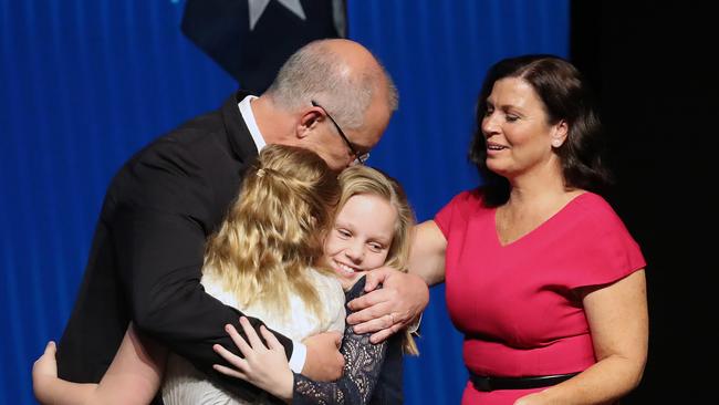 Scott Morrison embraces his family, wife Jenny, and daughters Lily and Abbey. Picture: Alex Coppel.