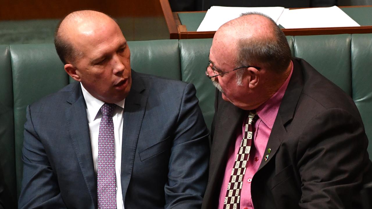 Former Member for Dickson, Peter Dutton and Member for Leichhardt, Warren Entsch, during question time in the House of Representatives in Canberra in 2017. (AAP Image/Mick Tsikas)