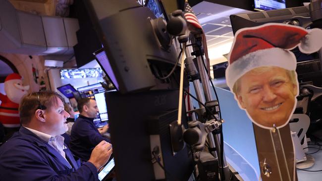 New York Stock Exchange traders on Tuesday as news came through Donald Trump intends to put tariffs on Mexican and Canadian imports. Picture: Getty Images