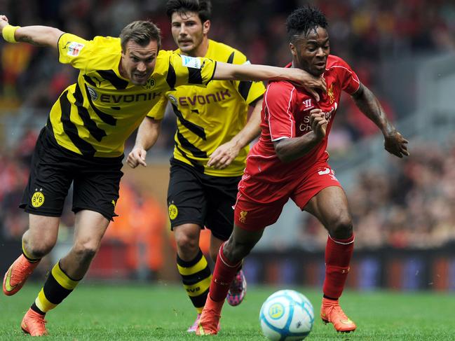 LIVERPOOL, ENGLAND - AUGUST 10: Raheem Sterling (R) of Liverpool and Kevin Grosskreutz of Borussia Dortmund battle for the ball during the Pre Season Friendly match between Liverpool and Borussia Dortmund at Anfield on August 10, 2014 in Liverpool, England. (Photo by Clint Hughes/Getty Images)