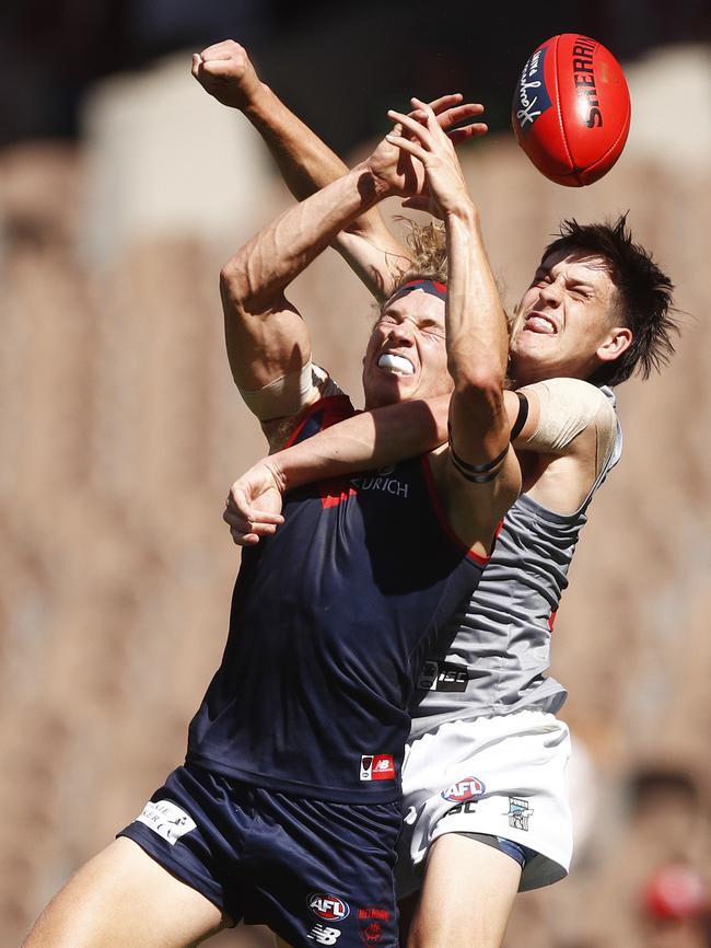 Port rookie Zak Butters spoils Melbourne’s Jayden Hunt. Picture: AAP Image/Daniel Pockett