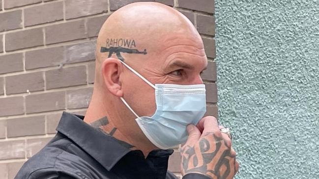 Liddington has an AK-47 gun tattoo with the racist word RAHOWA above his ear. Picture: Ashleigh Tullis