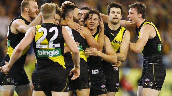 Richmond players get around Daniel Rioli after one of his preliminary final goals. Picture: Michael Klein