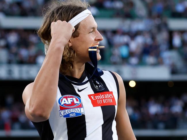 MELBOURNE, AUSTRALIA - SEPTEMBER 30: Jack Ginnivan of the Magpies celebrates after receiving his premiership medal during the 2023 AFL Grand Final match between the Collingwood Magpies and the Brisbane Lions at the Melbourne Cricket Ground on September 30, 2023 in Melbourne, Australia. (Photo by Dylan Burns/AFL Photos via Getty Images)