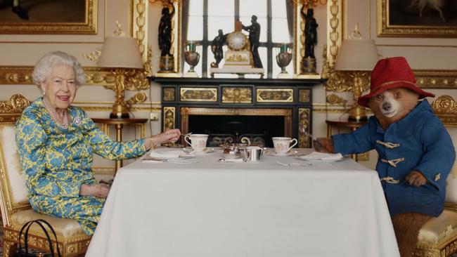 Queen Elizabeth II and Paddington Bear have cream tea at Buckingham Palace as part of the Queen's Platinum Jubilee celebrations in 2022. Picture: Buckingham Palace/Studio Canal/BBC Studios/Heyday Films via Getty Images