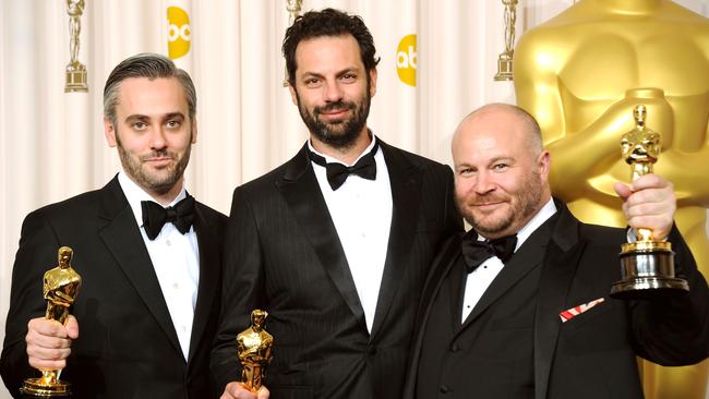 Sherman, centre, with producers Iain Canning and Gareth Unwin and the Best Picture Oscars for The King’s Speech in 2011. Picture: Getty Images