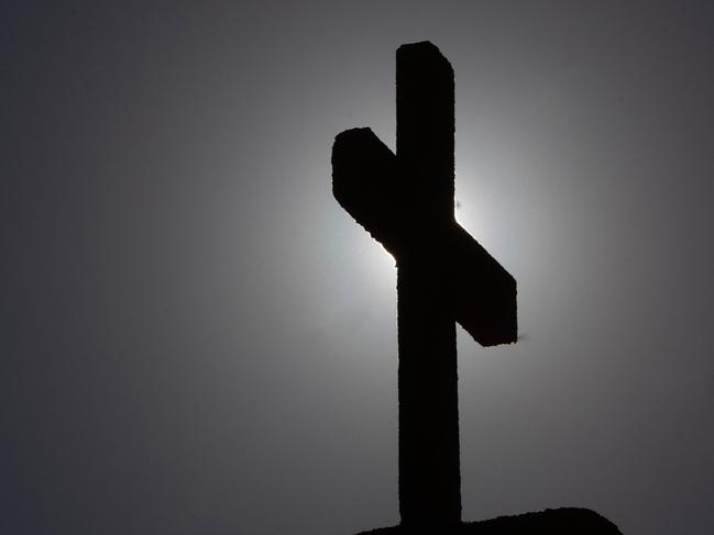 Picture of a cross taken in Punta de Tralca, west of Santiago, on July 30, 2018 as Chile's Episcopal Conference holds an extraordinary meeting to analyze the roots of the current crisis that the Catholic Church is experiencing in the country, burdened by the scandals of sexual abuse and cover-up, and how to overcome it. Chile is investigating more than 150 members of the country's embattled Catholic Church -- both clergymen and lay people -- for perpetrating or concealing the sexual abuse of children and adults, prosecutors said last week. / AFP PHOTO / CLAUDIO REYES