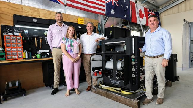 Labor Candidate for Leichhardt Matt Smith, Queensland senator Nita Green and Defence Minister Richard Marles inspect an Oxygen Jam machine manufactured by Smithfield company J3Seven. Picture: Brendan Radke