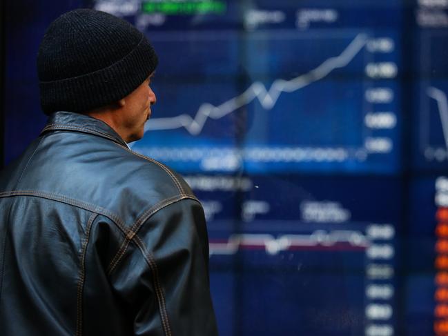 SYDNEY, AUSTRALIA - NewsWire Photos JULY 05, 2021: A member of the public is seen checking the stocks at the ASX in the CBD, as we enter week 2 of Covid-19  lockdown in Sydney Australia. Picture: NCA NewsWire / Gaye Gerard