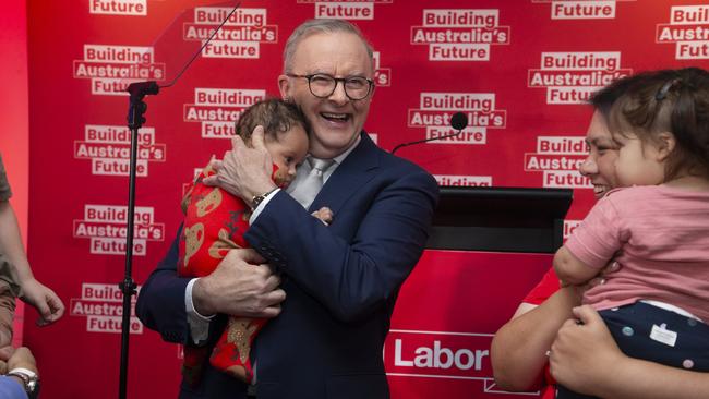 Anthony Albanese holds three-month-old Maisie after delivering a speech at the Morningside Panthers AFL club in Brisbane. Picture: NewsWire/Glenn Campbell