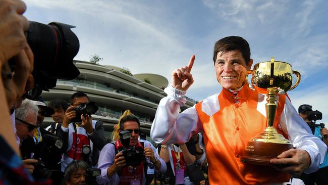 Jockey Craig Williams holds the Melbourne Cup Trophy after riding Vow And Declare to victory Picture: AAP