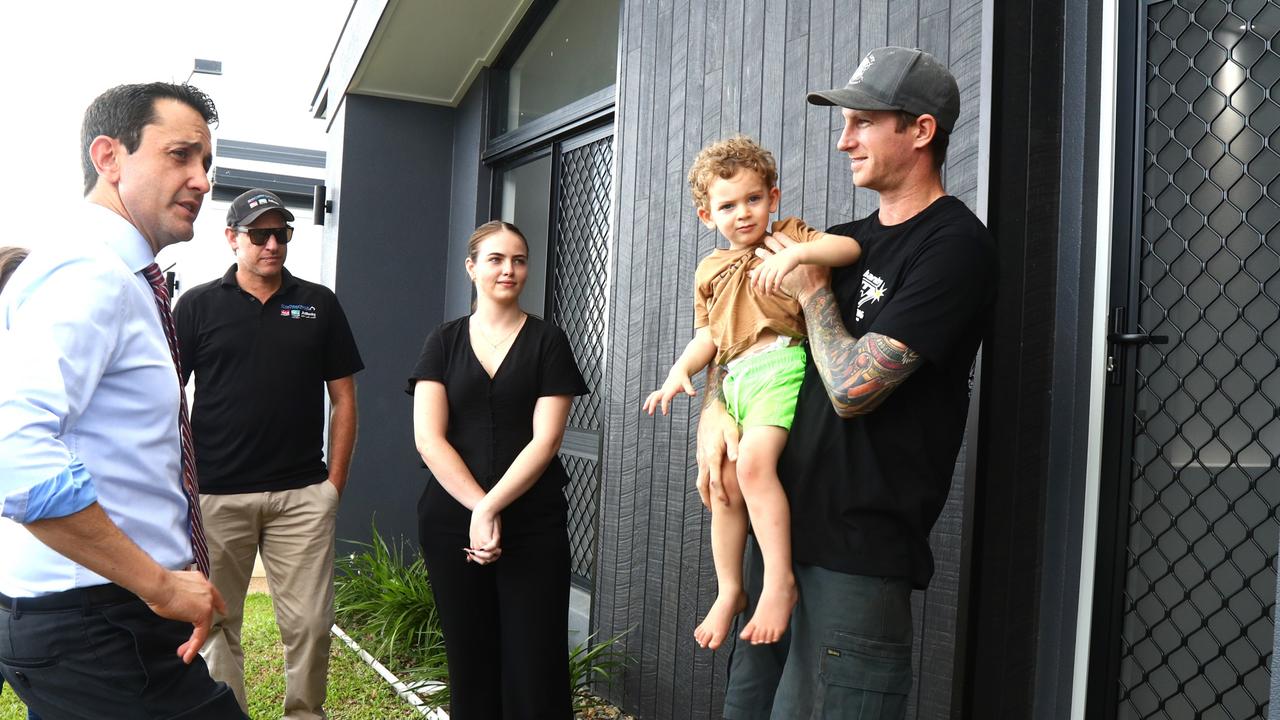 Premier David Crisafulli visits a new housing development at Bentley Park, Cairns and spoke with first homebuyer Aidan Maxwell and son Harry. Picture: Peter Carruthers