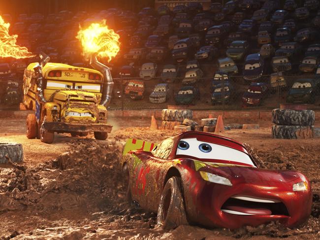 This image released by Disney shows Lightning McQueen, voiced by Owen Wilson, In "Cars 3," foreground, in a scene from "Cars 3." (Disney-Pixar via AP)