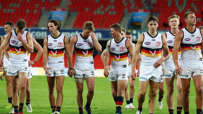 The Crows leave Metricon Stadium after losing to Gold Coast by 53 points and not managing a single point in the first quarter. Picture: Chris Hyde/Getty