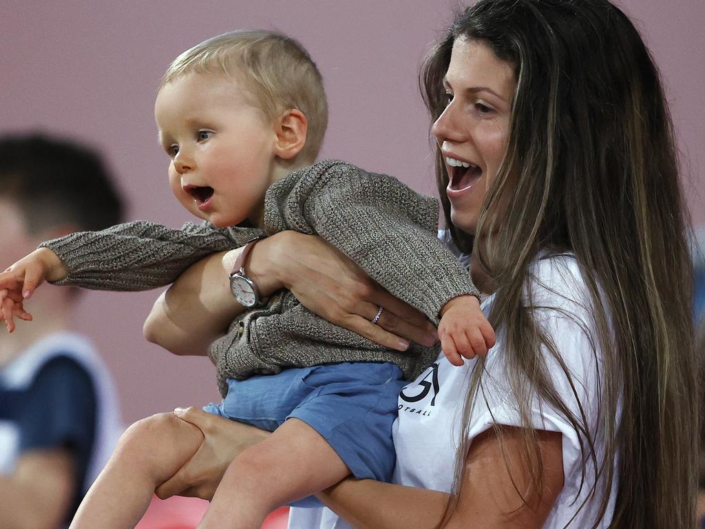 Jordan Ablett and son Levi cheer on dad Gary as the final siren sounds. Pic: Michael Klein