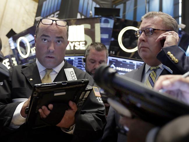 Traders work on the floor of the New York Stock Exchange, Tuesday, Aug. 18, 2015. U.S. stocks are lower in early trading after China's main index had its biggest fall since late July. (AP Photo/Richard Drew)