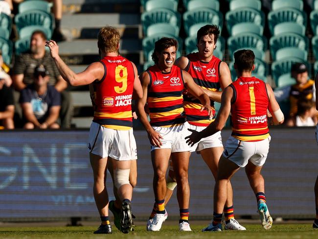 LAUNCESTON, AUSTRALIA - APRIL 23: Darcy Fogarty of the Crows (centre) celebrates with teammates after kicking the winning goal during the 2023 AFL Round 06 match between the Hawthorn Hawks and the Adelaide Crows at UTAS Stadium on April 23, 2023 in Launceston, Australia. (Photo by Michael Willson/AFL Photos via Getty Images)