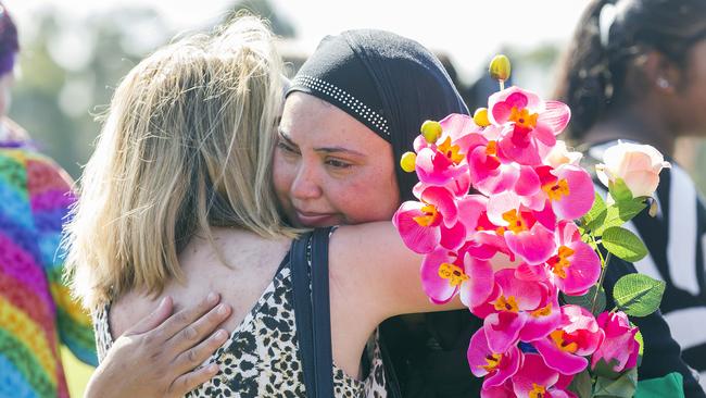 Zureen Sahib is comforted by people at the vigil. Picture: Sarah Matray