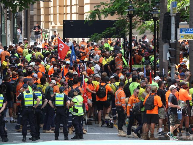 Police keep an eyee on protesters at Queens Gardens in Brisbane. Picture: Liam Kidston