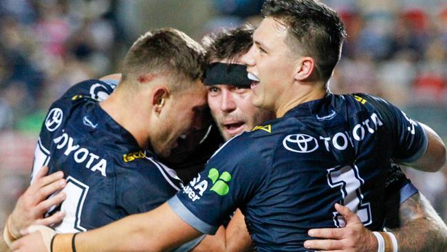 The Cowboys celebrate another Kyle Feldt try. Photo: AAP Image/Michael Chambers