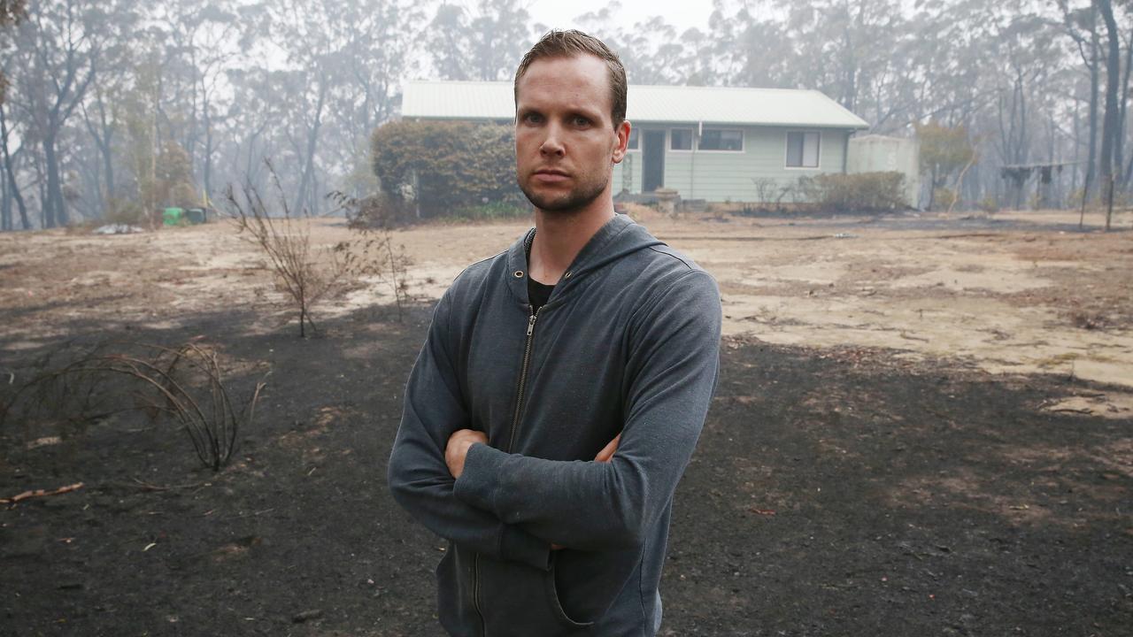 Robin Stone, 33, and his family had to flee their rented home in Wingello near Bundanoon and are staying in Moss Vale. He returned to collect belongings after firefighters saved the home. Picture: David Swift