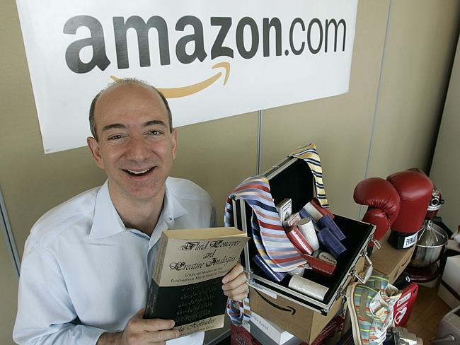 Jeff Bezos with some of the goodies you can with just a click of your mouse.