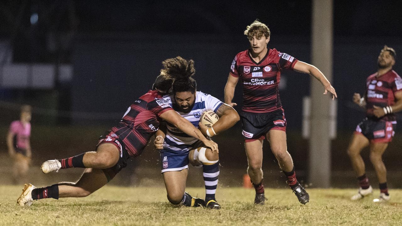 Brothers player Christopher Toese is tackled by Domenic Whittingham (left) and Jack Stenzel of Valleys.