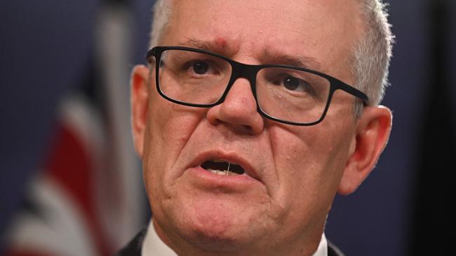 Australia's former prime minister Scott Morrison speaks to media during a press conference in Sydney on August 17, 2022. - Australia's Prime Minister Anthony Albanese on August 16 said that his predecessor Scott Morrison secretly seized control of five ministerial posts, labelling it an "unprecedented trashing of our democracy". (Photo by Steven Saphore / AFP)