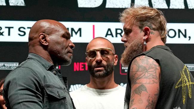 Mike Tyson and Jake Paul face each other during a press conference this week. (Photo by TIMOTHY A. CLARY / AFP)