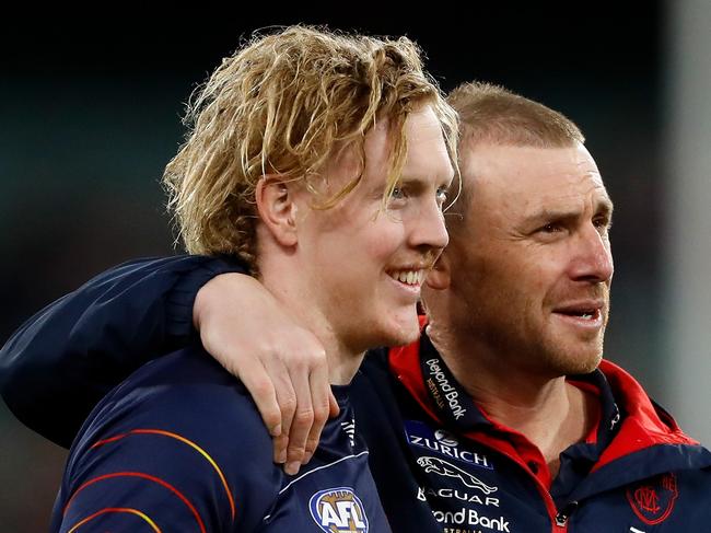 MELBOURNE, AUSTRALIA - SEPTEMBER 09: Clayton Oliver of the Demons and Simon Goodwin, Senior Coach of the Demons are seen during the 2022 AFL Second Semi Final match between the Melbourne Demons and the Brisbane Lions at the Melbourne Cricket Ground on September 9, 2022 in Melbourne, Australia. (Photo by Dylan Burns/AFL Photos via Getty Images)