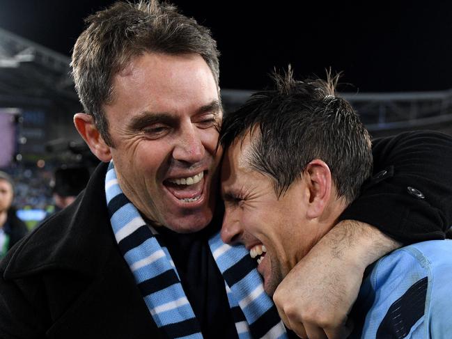 *This picture has been selected as one of the Best of the Year Sports images for 2019*  NSW Blues coach Brad Fittler celebrates with Mitchell Pearce following their win in Game 3 of the 2019 State of Origin series between the New South Wales Blues and the Queensland Maroons at ANZ Stadium in Sydney, Wednesday, July 10, 2019. (AAP Image/Dan Himbrechts) NO ARCHIVING, EDITORIAL USE ONLY