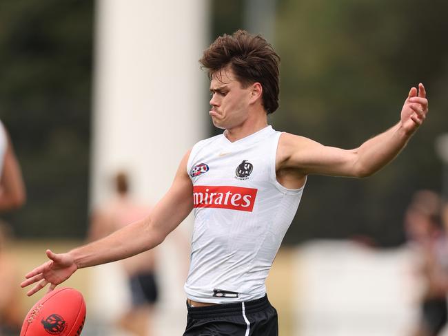 MELBOURNE, AUSTRALIA - APRIL 03: Josh Carmichael of the Magpies kicks the ball during a Collingwood Magpies AFL training session at Olympic Park Oval on April 03, 2024 in Melbourne, Australia. (Photo by Robert Cianflone/Getty Images)