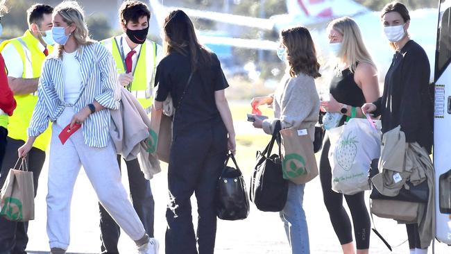 Family of Sydney Swans and GWS Giants AFL players leave Brisbane airport after completing quarantine last year. Picture: John Gass