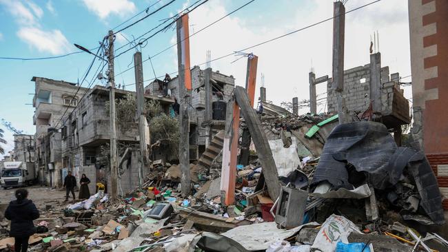 People inspect the damage to their homes caused by Israeli airstrikes in Rafah, Gza Strip, on Saturday. Picture: Getty Images