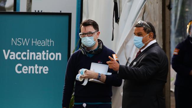 People line up for their vaccination for the Vaccination Hub at Sydney Olympic Park. Picture: NCA NewsWire / Gaye Gerard