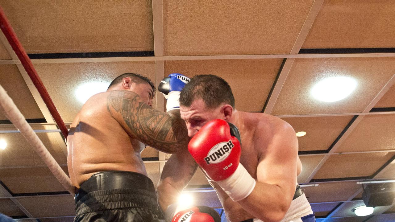 Paul Gallen and Herman Ene-Purcell fight it out in Toowoomba. Friday, Jan 29, 2016.