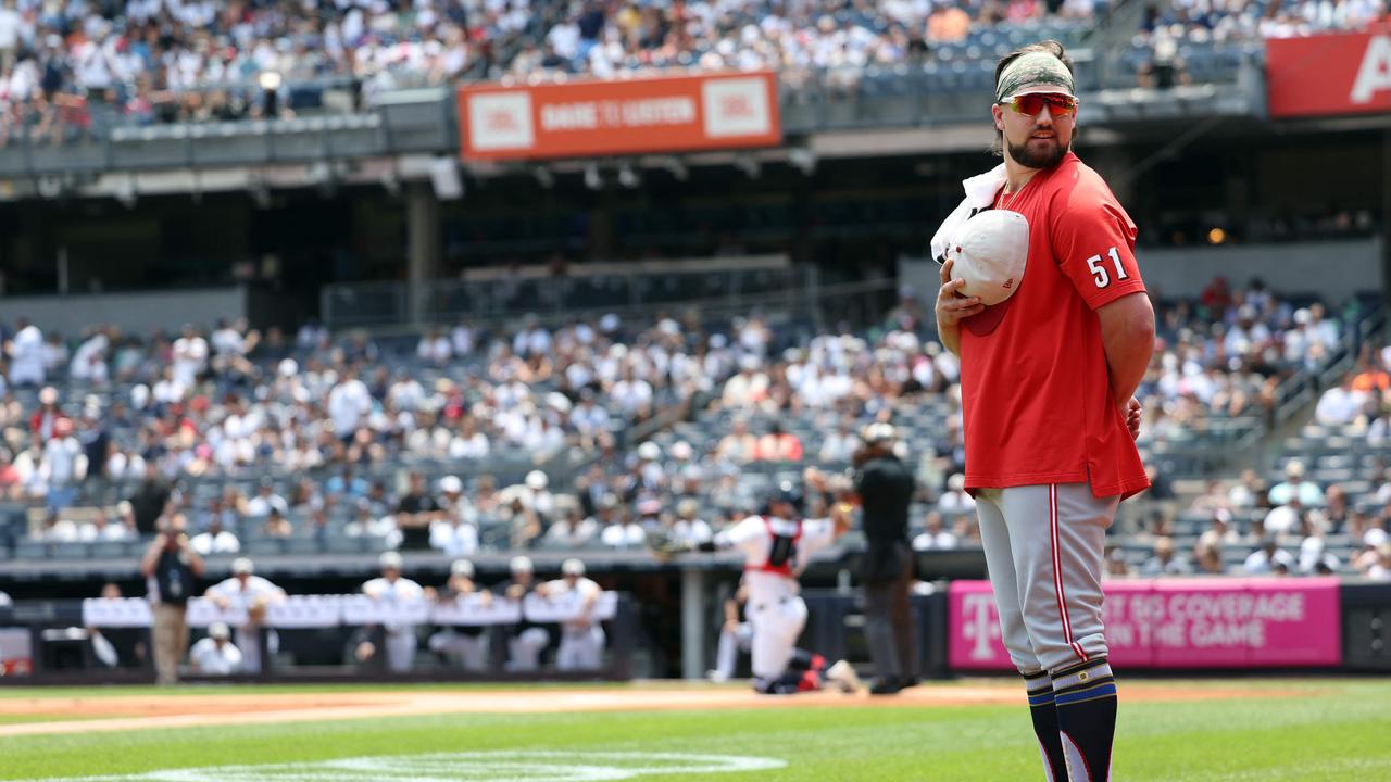 Graham Ashcraft #51 of the Cincinnati Reds stands for the national anthem before the game against the New York Yankees. Luke Hales/Getty Images/AFP