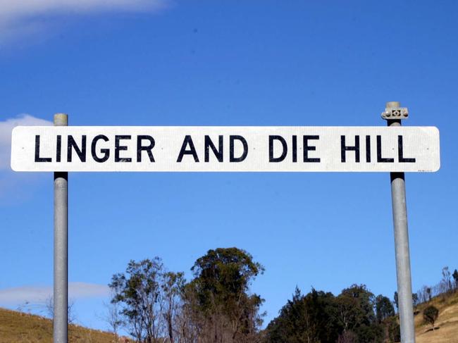 JULY 31, 2003 : Linger And Die Hill sign in Monderai Valley south of Gloucester, 07/03.NSW / Sign