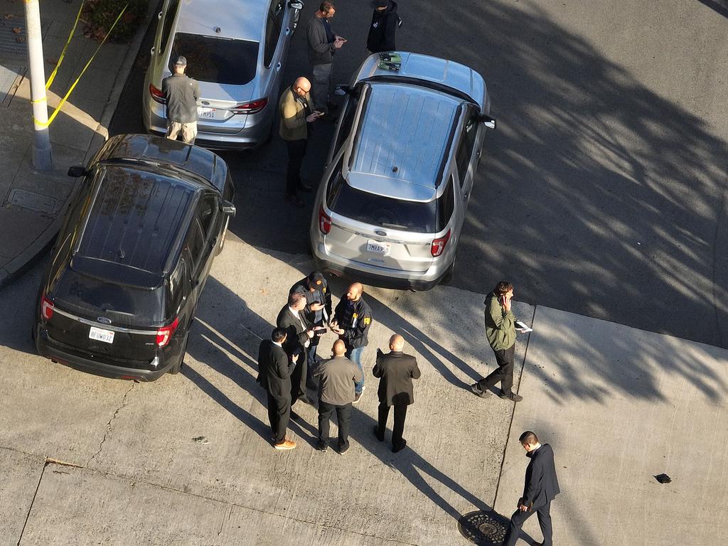 San Francisco police officers and FBI agents gather in front of the home of US Speaker of the House Nancy Pelosi. Picture: Justin Sullivan/Getty Images/AFP