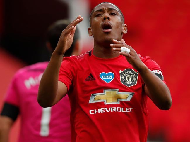 Manchester United's French striker Anthony Martial reacts after missing a chance during the English Premier League football match between Manchester United and Southampton at Old Trafford in Manchester, north-west England, on July 13, 2020. (Photo by Clive Brunskill / POOL / AFP) / RESTRICTED TO EDITORIAL USE. No use with unauthorized audio, video, data, fixture lists, club/league logos or 'live' services. Online in-match use limited to 120 images. An additional 40 images may be used in extra time. No video emulation. Social media in-match use limited to 120 images. An additional 40 images may be used in extra time. No use in betting publications, games or single club/league/player publications. /