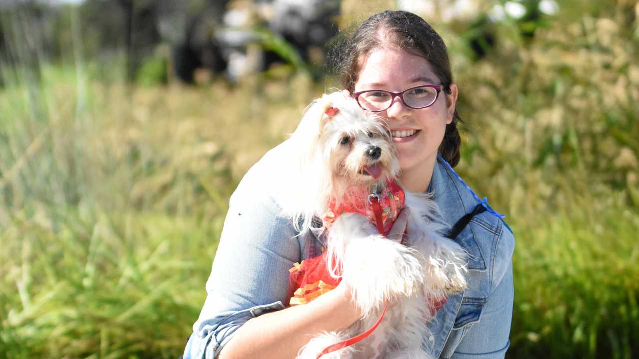 Tara Ligt and Daisy have a cuddle at the end of RSPCA Million Paws Walk on Sunday. Picture: Frances Klein