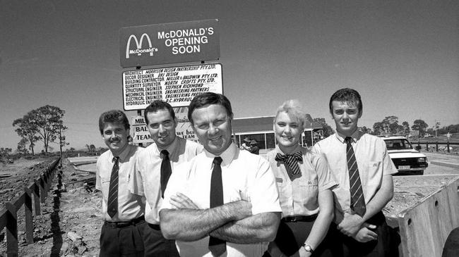 COUNTING DOWN: Ron Reseck (centre) and staff members (from left) Dean Bennett, Brent Gilmore, Angela Grieve and Trevor Rogers outside Mackay&#39;s first McDonald&#39;s Restaurant ahead of its opening in 1990. Picture: Daily Mercury Archives