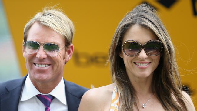 Elizabeth Hurley and Shane Warne attend Ascot in 2013.