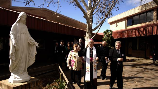 End of an era: a look back at McCarthy Catholic College: Reverend Kevin Manning, Bishop of Parramatta Diocese, blesses the school buildings of McCarthy Catholic College at Emu Plains in 2007.