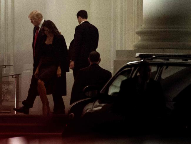 US President Donald Trump and US first lady Melania Trump walk to a motorcade outside the White House. Picture: AFP