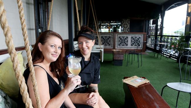 Miss Chief bar and eatery's Rebecca and Jessie Barnett on the Miss Chief balcony.