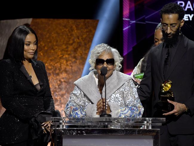 Lauren London (wife), Angelique Smith (mother) and Samiel Asghedom (brother) of the late rapper Nipsey Hussle’s family, accepted Best Rap Performance for ‘Racks in the Middle’ at the Grammys. Picture: Getty Images