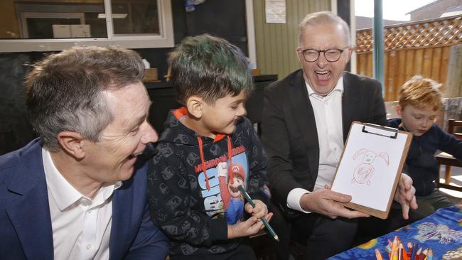 Education Minister Jason Clare jokes with four-year-old Noah Alameddine and Prime Minister Anthony Albanese at a daycare centre in Sydney. Picture: NewsWire/John Appleyard